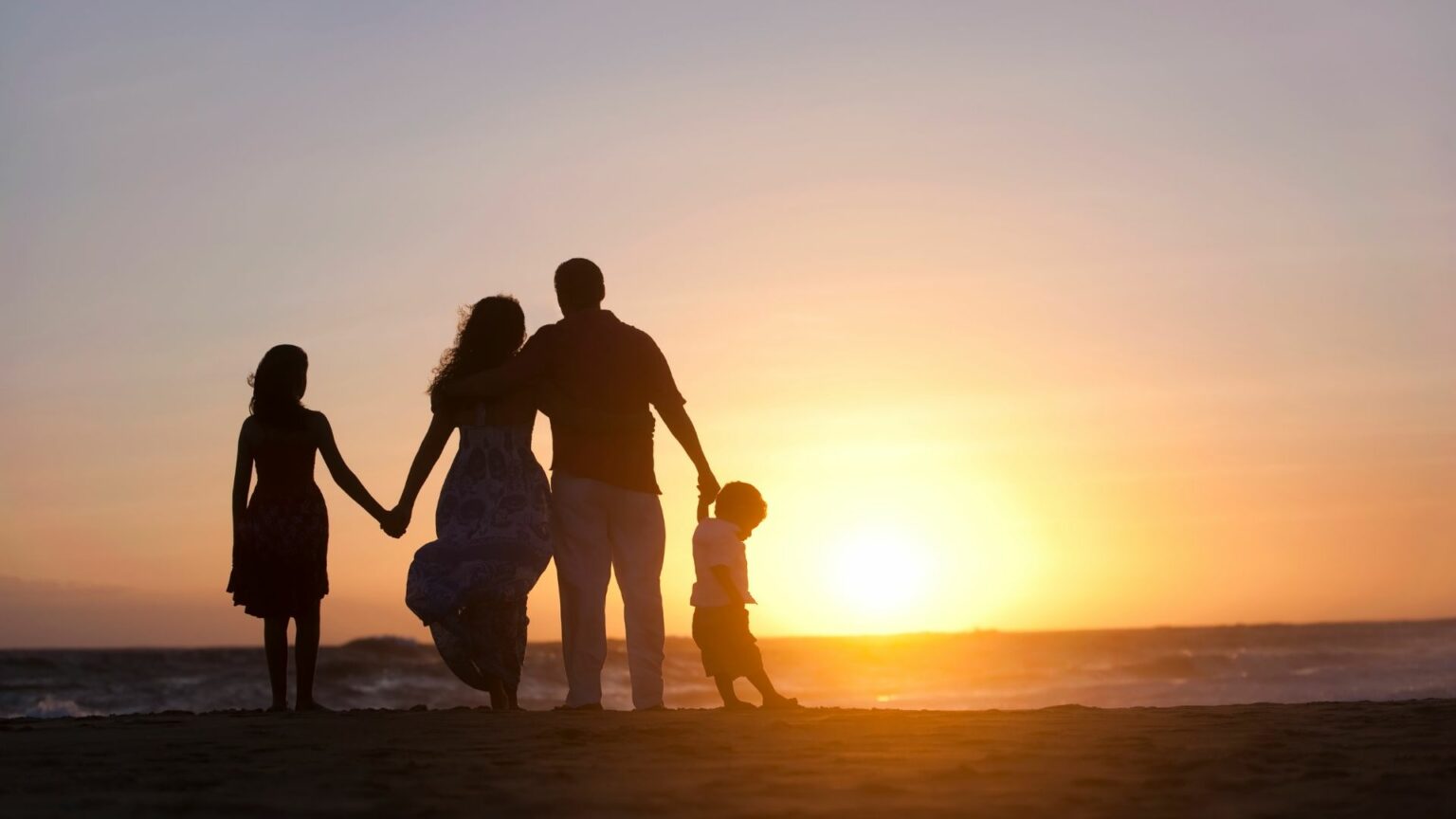 H-2A Worker and Family Enjoying the sunset on a beach