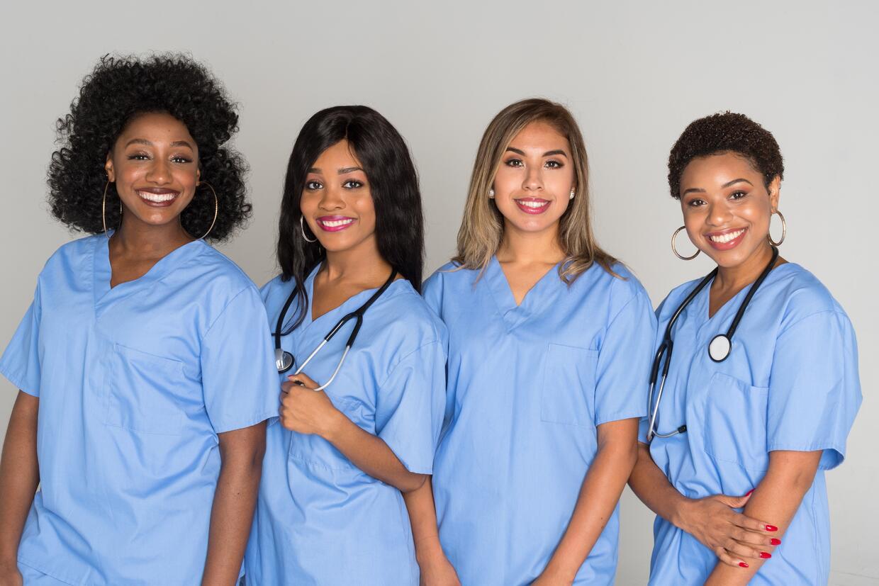 FOUR FEMALE NURSES WORKING TOGETHER IN THE USA